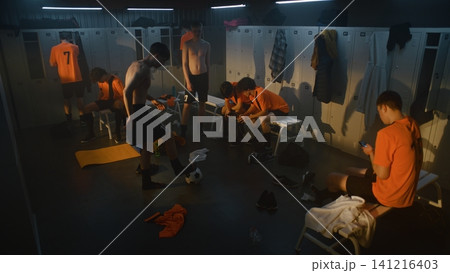 Young Football Players Spending Time Together in Locker Room after Practice Young Football Players Spending Time Together in Locker Room after Practice 141216403