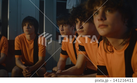 Sport Education and Theory, Coach Briefing Young Players in Locker Room Sport Education and Theory, Coach Briefing Young Players in Locker Room 141216411