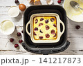 Step 8. The process of cooking cottage cheese casserole with cherries  in an air fryer, in kitchen gadget modern. Lifestyle trendy of new cooking. Healthy cooking with air fryer. 141217873