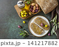Italian ciabatta bread with olive oil on a stone surface. Delicious and healthy food. Vegan. Top view flat lay background. Copy space. 141217882