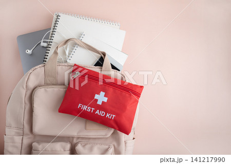 First aid kit on backpack with school supplies First aid kit on backpack with school supplies 141217990