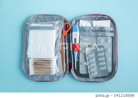 Open medical first aid kit with supplies for health Open medical first aid kit with supplies for health 141218006
