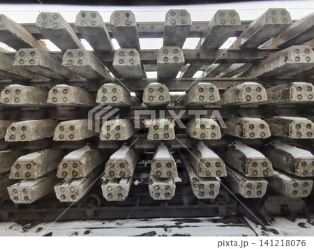 Stacked concrete railway sleepers arranged in neat rows for storage Stacked concrete railway sleepers arranged in neat rows for storage 141218076