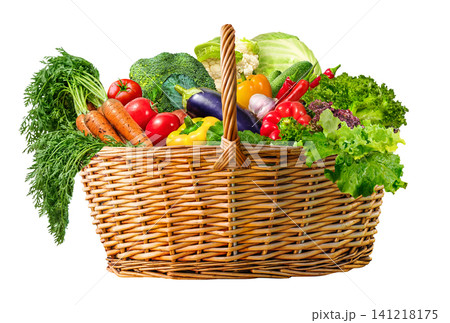 A Fresh Vegetable wicker Basket Overflowing with a Variety of Organic Farmer Produce on white A Fresh Vegetable wicker Basket Overflowing with a Variety of Organic Farmer Produce on white 141218175