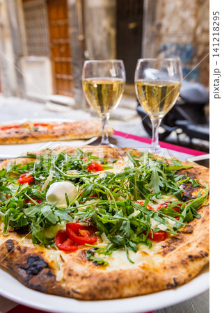 Italian pizza with arugula Italian pizza with arugula 141218295