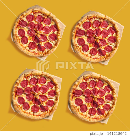 freshly baked pizzas salami on bright red background, top view freshly baked pizzas salami on bright red background, top view 141218642