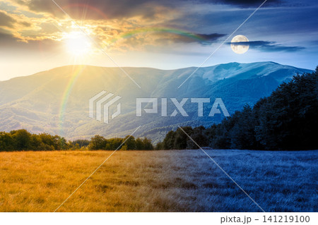 mountain landscape of ukraine. day meet night. sun and moon over alpine grassy meadow and deciduous forest on the hill. equinox nature background for carpathian adventures 141219100