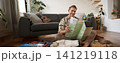 Portrait of handsome young man, traveller with suitcase, looking at paper map, choosing where to go on vacation, going on holiday, choosing route 141219118