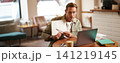 Portrait of young handsome man in glasses, private tutor teaching student online, pointing at his notebook, showing something, video chats via laptop application, working remotely in cafe 141219145