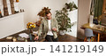 Portrait of a man in office, businessman making a phone call, having a conversation over the phone, receive a call, standing in office, leaning on table 141219149