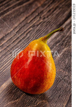 Ripe red yellow pear on rustic wooden surface 141219319