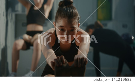 Girl Performs Deep Forward Bend Stretch in Warm Up Session, Improving Hamstring Flexibility 141219682