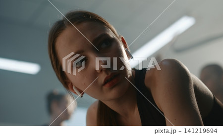 Angry and Exhausted Teen Gymnast Breathing Heavily After Hard Training Angry and Exhausted Teen Gymnast Breathing Heavily After Hard Training 141219694