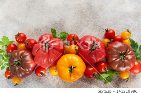 Fresh colorful heirloom tomatoes and cherry tomatoes harvest Fresh colorful heirloom tomatoes and cherry tomatoes harvest 141219996