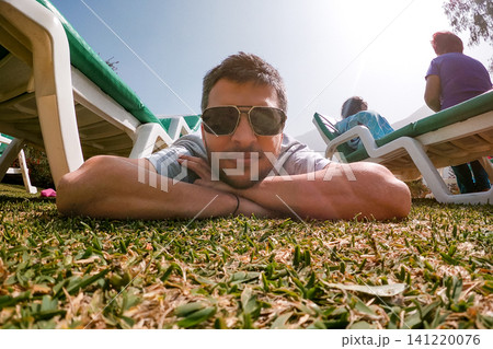 Relaxed Man Lying on Grass UGC Perspective Relaxed Man Lying on Grass UGC Perspective 141220076