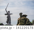 Volgograd, Russia - 05.23.2023: Iconic view of The Motherland Calls statue on Mamayev Kurgan with additional heroic sculptures in the foreground. One of the tallest statues in the world, symbolizing t 141220178