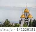 Volgograd, Russia - 05.23.2023: All Saints Church on Mamayev Kurgan. Orthodox church golden domes against cloudy sky. Historic Russian architecture with onion-shaped spires and religious heritage land 141220181