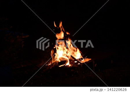 fire flames with sparks on a black background, close-up fire flames with sparks on a black background, close-up 141220626