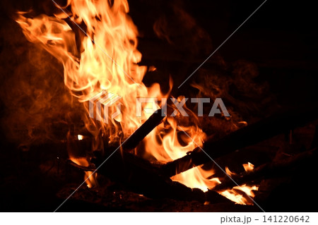 fire flames with sparks on a black background, close-up fire flames with sparks on a black background, close-up 141220642
