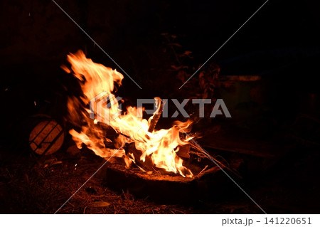 fire flames with sparks on a black background, close-up 141220651