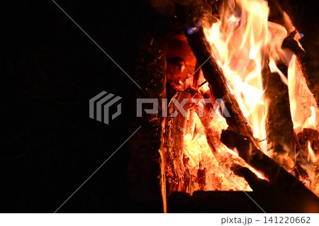 fire flames with sparks on a black background, close-up fire flames with sparks on a black background, close-up 141220662