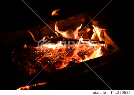 fire flames with sparks on a black background, close-up 141220682
