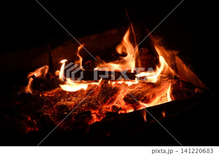 fire flames with sparks on a black background, close-up fire flames with sparks on a black background, close-up 141220683