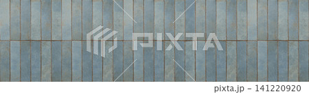 Blue ceramic subway tiles arranged in a vertical stack bond pattern with aged grout lines 141220920