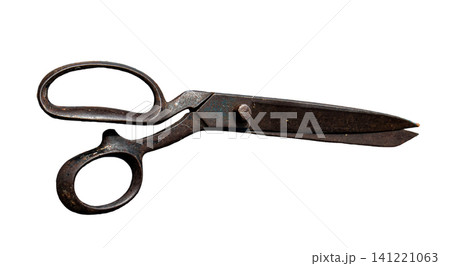 Antique tailor shears with dark metal blades and worn finger loops sit alone on a transparent background. These scissors show the marks of use over time in their design. 141221063