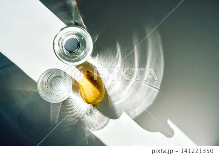 Refreshing water in glass and bottle with lemon 141221350