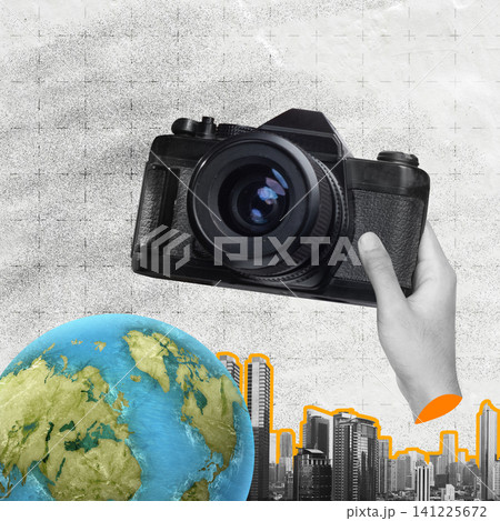 Surreal collage featuring a hand holding a vintage camera over a globe and city skyline, representing global travel, journalism, and urban exploration Surreal collage featuring a hand holding a vintage camera over a globe and city skyline, representing global travel, journalism, and urban exploration 141225672