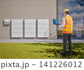 Asian engineer or technician with battery energy storage system for residential used 141226012