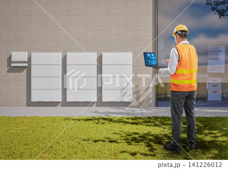 Asian engineer or technician with battery energy storage system for residential used Asian engineer or technician with battery energy storage system for residential used 141226012