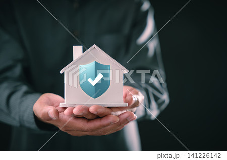 Home insurance and property protection represented by man holding small house model with secure shield icon, showing real estate financial coverage mortgage safety and risk planning Home insurance and property protection represented by man holding small house model with secure shield icon, showing real estate financial coverage mortgage safety and risk planning 141226142