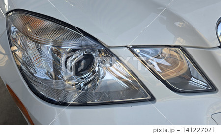 White Mercedes Luxury Sedan Front exterior showing the headlamp Detailing With Reflective Chrome Finish 141227021