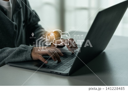 Person using laptop computer with artificial intelligence digital interface showing AI search technology and virtual machine learning concept illustration Person using laptop computer with artificial intelligence digital interface showing AI search technology and virtual machine learning concept illustration 141228485
