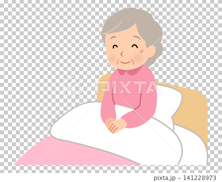一位老婦人坐在床上微笑。 一位老婦人坐在床上微笑。 141228973