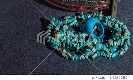 Turquoise beads bracelet ring. Jewelry blue color natural materials. Black background 141232694