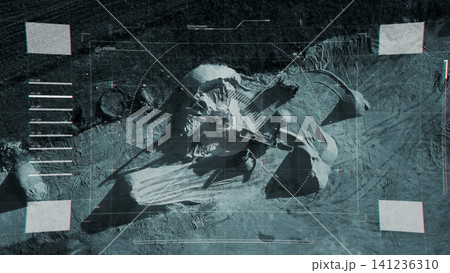 Surveillance view of land with equipment and structures at construction site Surveillance view of land with equipment and structures at construction site 141236310