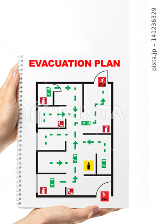 Evacuation plan showing emergency routes and exits in a building layout for safety instructions Evacuation plan showing emergency routes and exits in a building layout for safety instructions 141236329