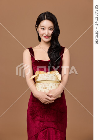 Celebration portrait with wrapped presents and party balloon 141237585