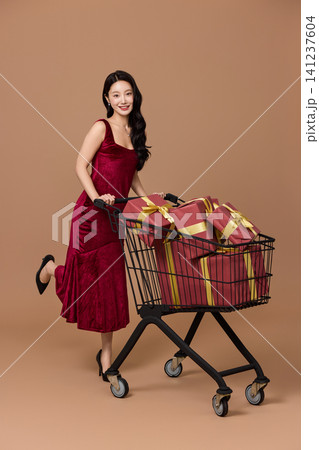 Holiday sale concept with a cart full of presents Holiday sale concept with a cart full of presents 141237604