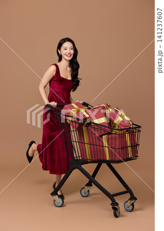 Elegant woman shopping with gift boxes and bags Elegant woman shopping with gift boxes and bags 141237607