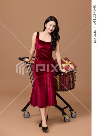 Holiday sale concept with a cart full of presents Holiday sale concept with a cart full of presents 141237640