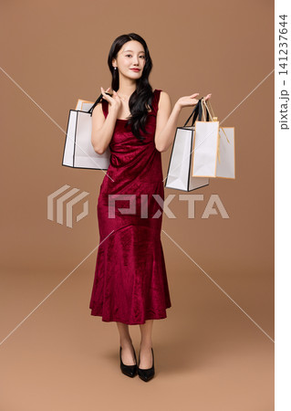 Holiday sale concept with a cart full of presents Holiday sale concept with a cart full of presents 141237644