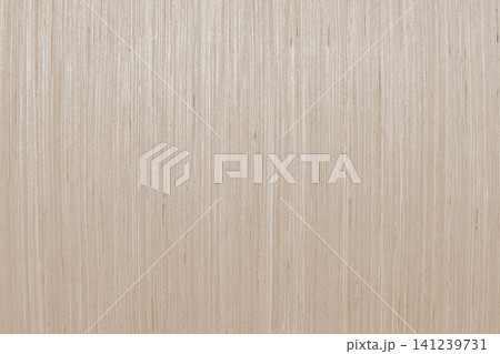 Full frame macro view of a light beige plywood board surface with a fine vertical natural grain pattern of wooden fibers creating a clean minimalist backdrop Full frame macro view of a light beige plywood board surface with a fine vertical natural grain pattern of wooden fibers creating a clean minimalist backdrop 141239731
