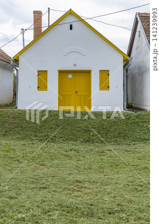 Traditional yellow and white wine cellar in Palkonya, Hungary Traditional yellow and white wine cellar in Palkonya, Hungary 141239993