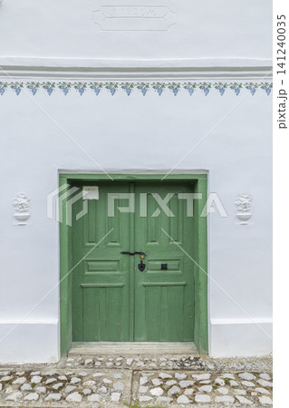 Traditional green wine cellar door in Palkonya, Hungary Traditional green wine cellar door in Palkonya, Hungary 141240035