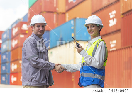 Business Team Cargo Container Shipping Inspection. Import and Export Freight at Port. Successful and accomplished work of teamwork Inspecting Containers Shipment. Shake hand and smile worker. Business Team Cargo Container Shipping Inspection. Import and Export Freight at Port. Successful and accomplished work of teamwork Inspecting Containers Shipment. Shake hand and smile worker. 141240992