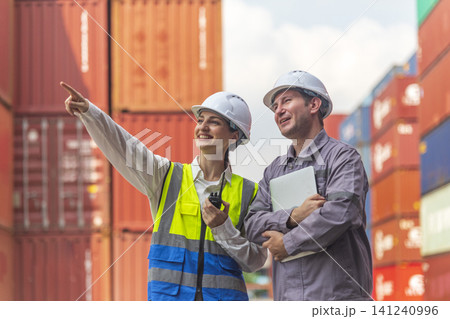 Business Team Cargo Container Shipping Inspection. Import and Export Freight at Port.  Successful and accomplished work of teamwork Inspecting Containers Shipment. Shake hand and smile worker. 141240996